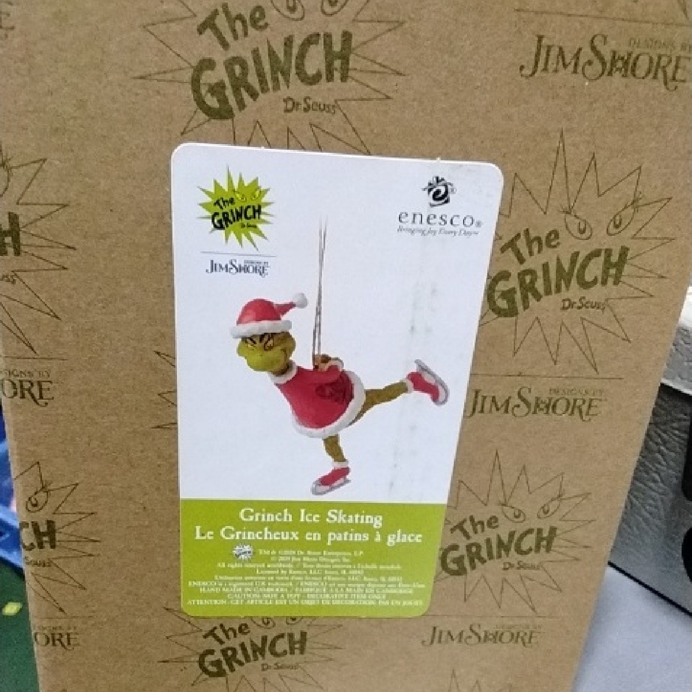 Jim Shore Grinch in Festive Red Skating Pose